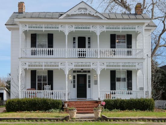 Modern Victorian home exterior with white color