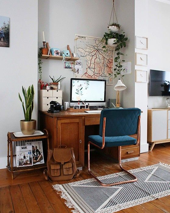 Eclectic office home with blue chair