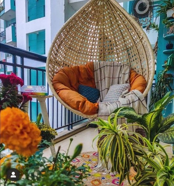 Hanging chair in eclectic balcony