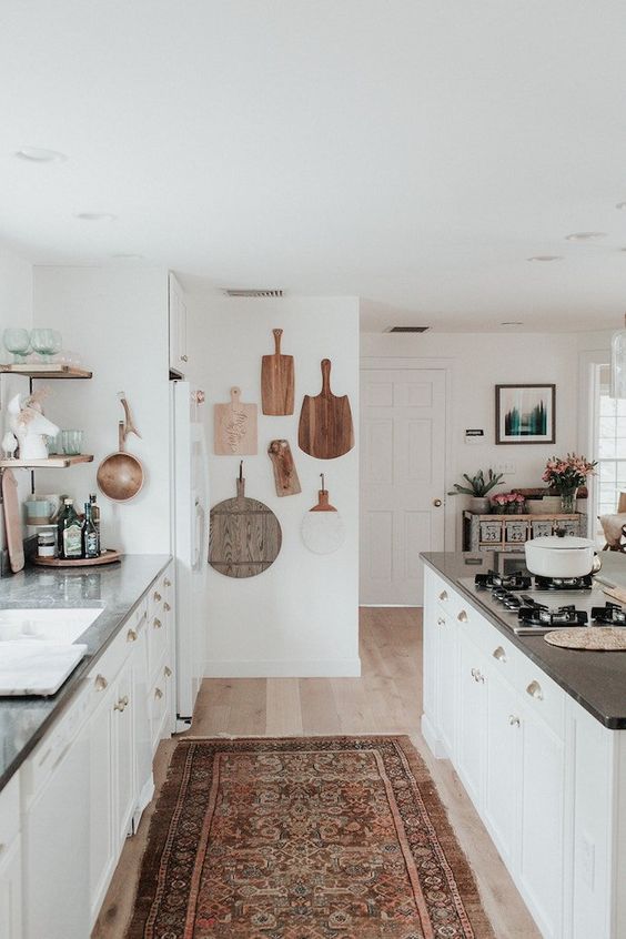 White small bohemian kitchen with cutting board