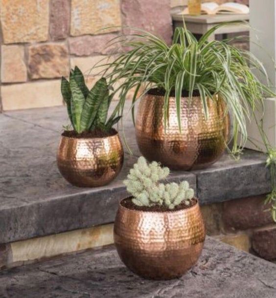 Shiny gold outdoor plant pot